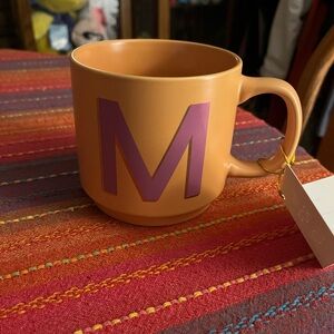 Orange Mug with Purple 'M'